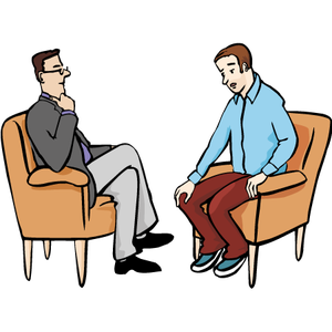 Zwei Männer sitzen sich gegenüber und reden.